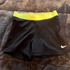 Black/neon yellow Nike spandex